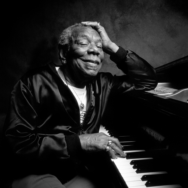 Champion Jack Dupree portrait at piano, black & white 